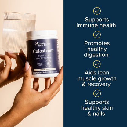 Unflavored bovine colostrum powder container held with a glass of water, highlighting immune support, digestion, muscle recovery, and skin health benefits