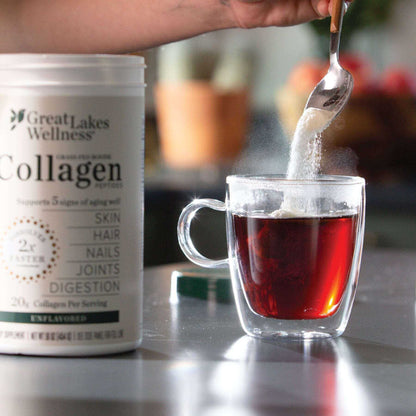 10oz Collagen Peptides powder being added to a glass cup of tea, showing Great Lakes Wellness packaging for skin, hair, nails, joints, and digestion support